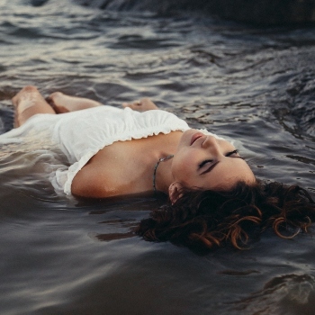 Close up of person laying in water